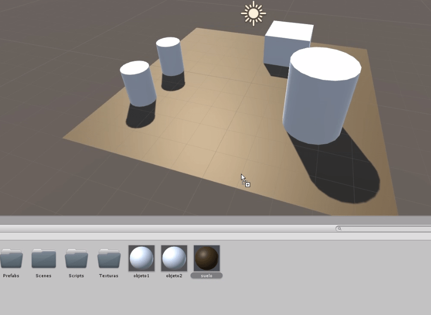 programa unity3d se observa una escena con un plano, un cubo y dos cilindros. El plano está pintado de marrón.