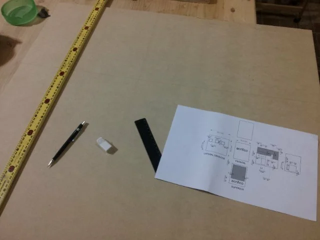 draw for the desing of mdf cabinet, ruler, pencil and eraser